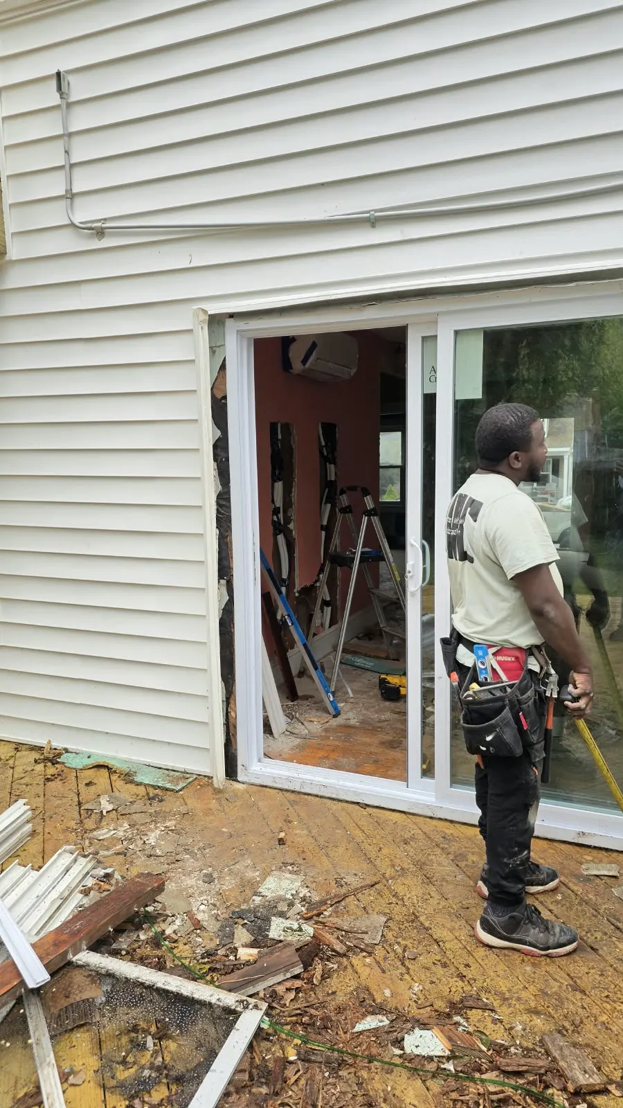 757 Contracting Services crew member at a sliding door installation in Hampton, VA