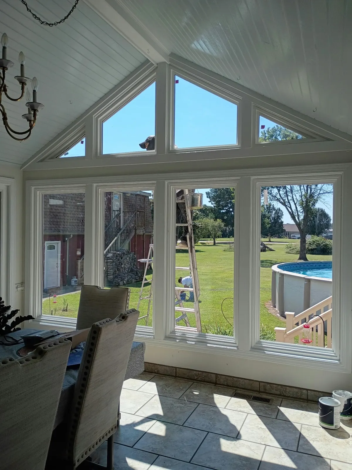 Interior of a sunroom with tall installed windows and a tile floor in Hampton, VA