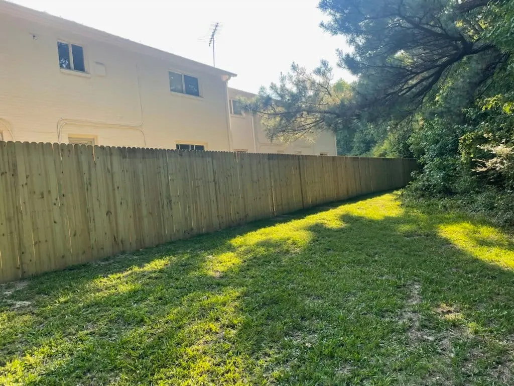 New wood privacy fence along a backyard in Hampton, VA