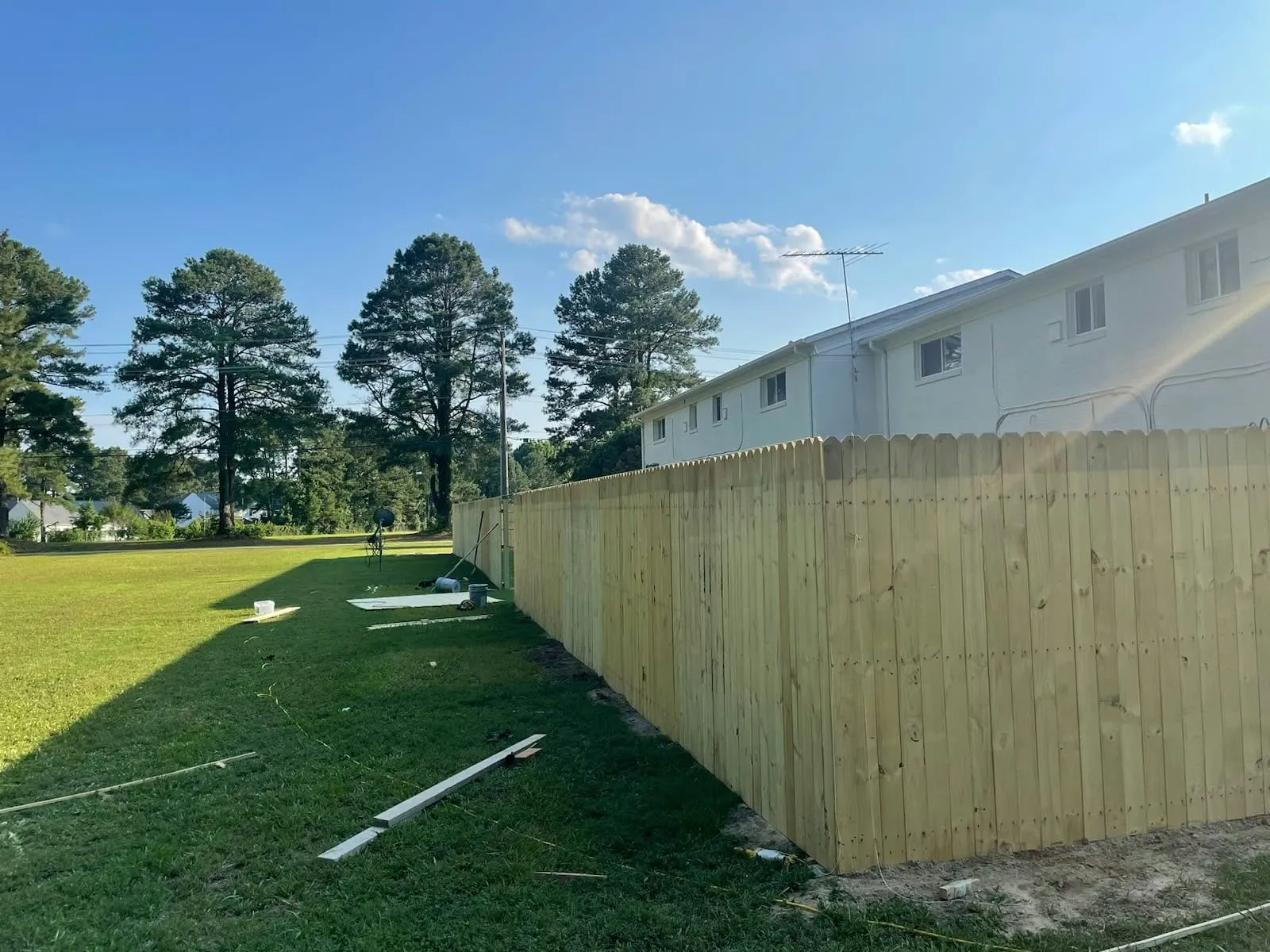 Long wood privacy fence built along a lawn in Hampton, VA